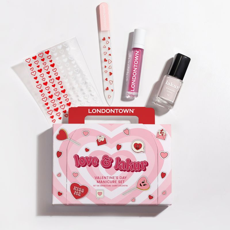 Valentine's Day manicure set labeled "love & lakur" includes nail polish, file, stickers, and cuticle oil, all in pink and red tones.